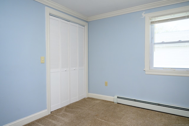 unfurnished bedroom featuring crown molding, a closet, light colored carpet, and a baseboard radiator