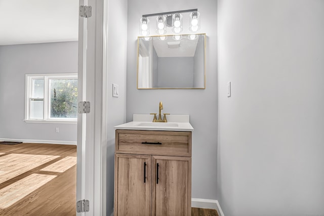 bathroom featuring vanity and hardwood / wood-style flooring