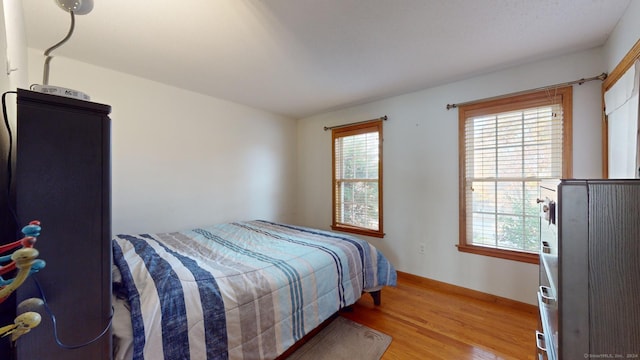 bedroom featuring light wood-type flooring