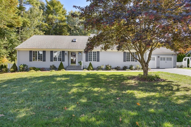 view of front of property with driveway, an attached garage, and a front lawn