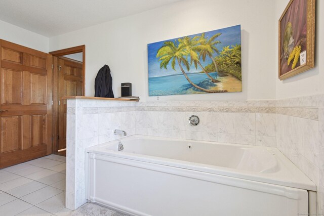 full bath featuring a garden tub and tile patterned flooring