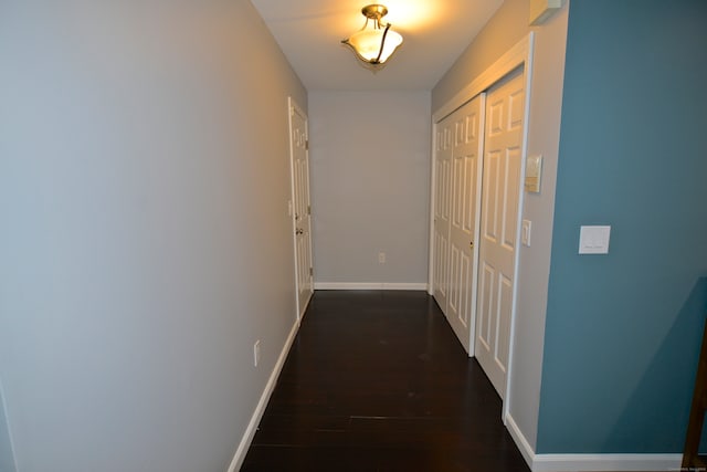 corridor featuring dark hardwood / wood-style floors