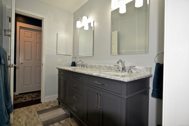 bathroom with vanity and hardwood / wood-style floors