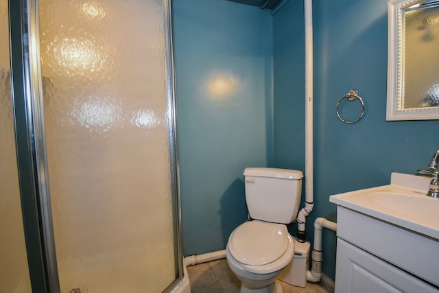 bathroom featuring toilet, tile patterned flooring, vanity, and a shower with door