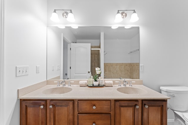 bathroom with toilet and vanity