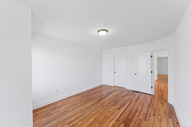 unfurnished bedroom with light wood-type flooring