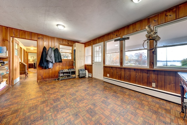 interior space featuring a baseboard heating unit