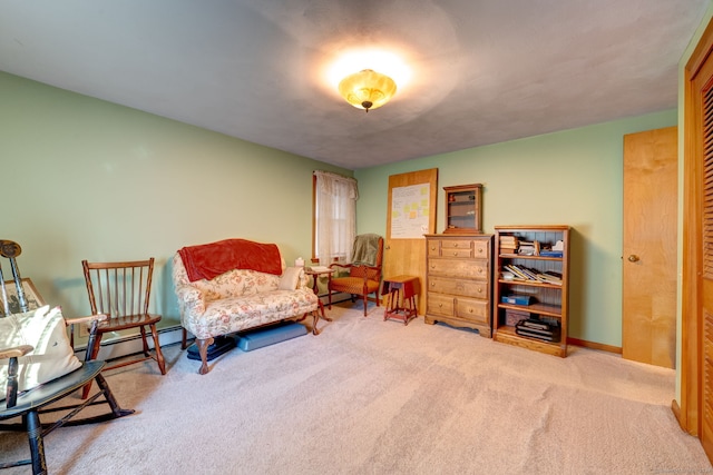 sitting room featuring carpet floors and a baseboard radiator