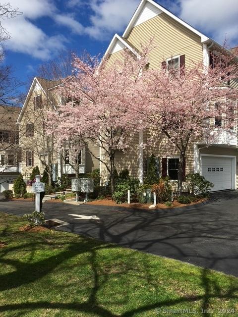 exterior space featuring a front lawn and a garage