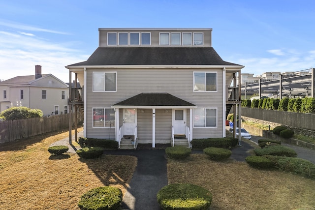 30 Merwin St Unit 6, Norwalk, CT 06850 - townhome / multi-family property featuring a shingled roof, entry steps, and a balcony