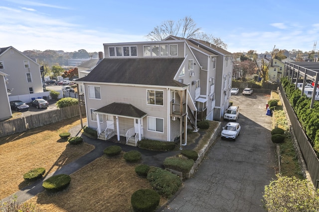 30 Merwin St Unit 6, Norwalk, CT 06850 - view of front facade with a residential view, asphalt driveway, and a shingled roof