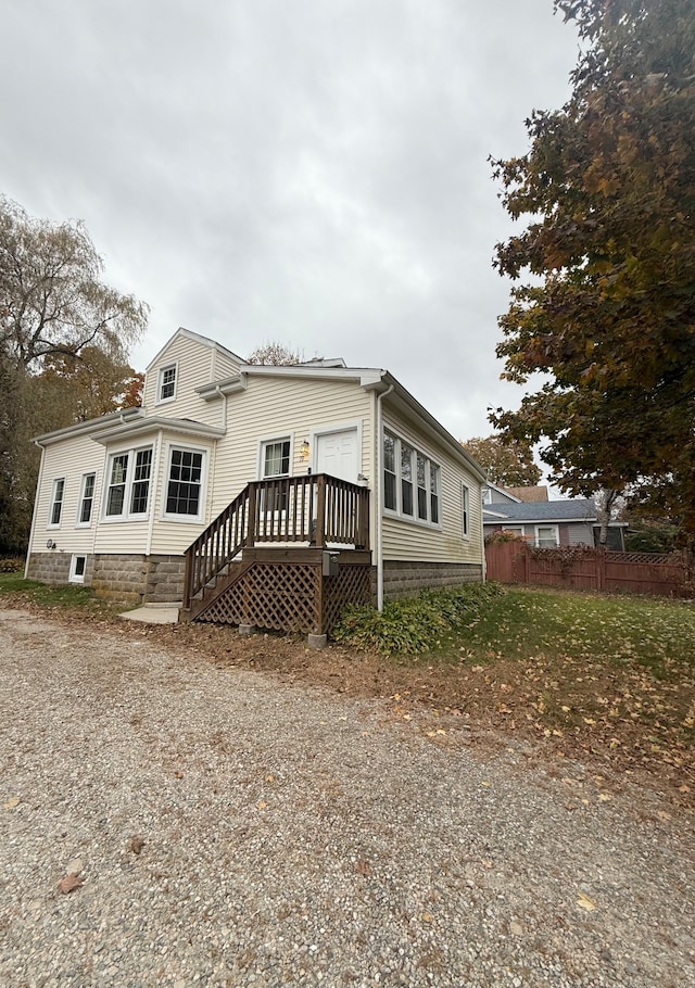 view of home's exterior with a deck