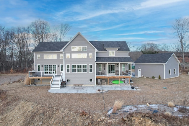 rear view of house with a wooden deck