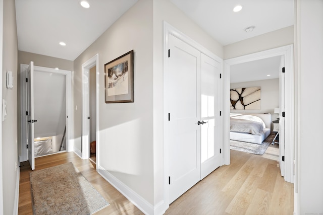 hall with light hardwood / wood-style floors