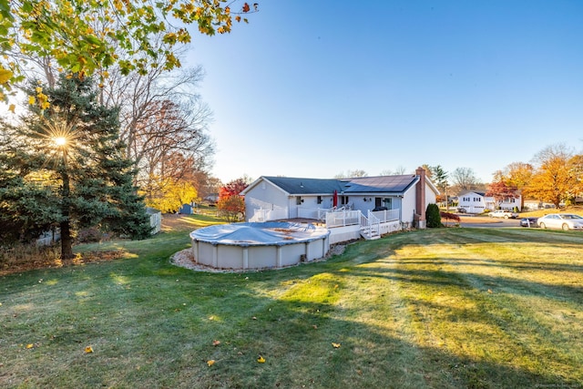 view of yard with a covered pool