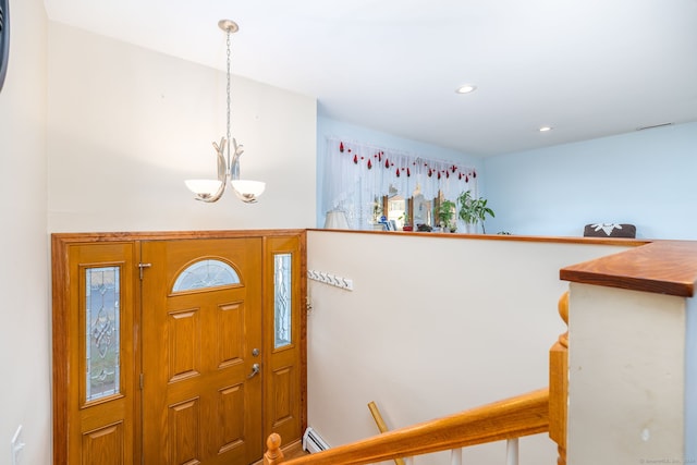 entryway featuring an inviting chandelier