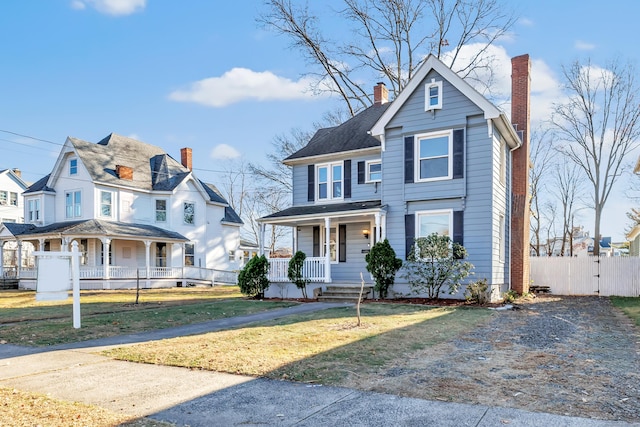 view of front facade with a porch and a front yard