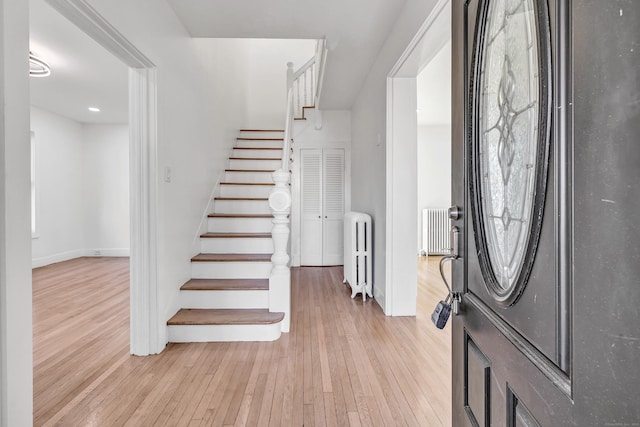 entryway featuring light hardwood / wood-style floors and radiator