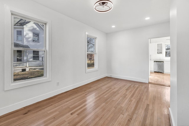 unfurnished room featuring light wood-type flooring