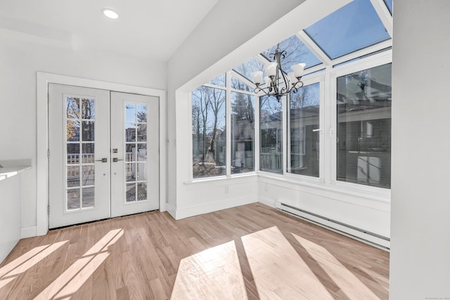 unfurnished sunroom with french doors, a notable chandelier, and a baseboard heating unit