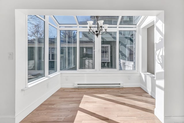 unfurnished sunroom with a chandelier and a baseboard radiator