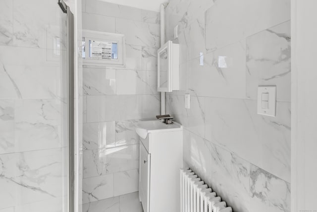 bathroom featuring vanity and radiator