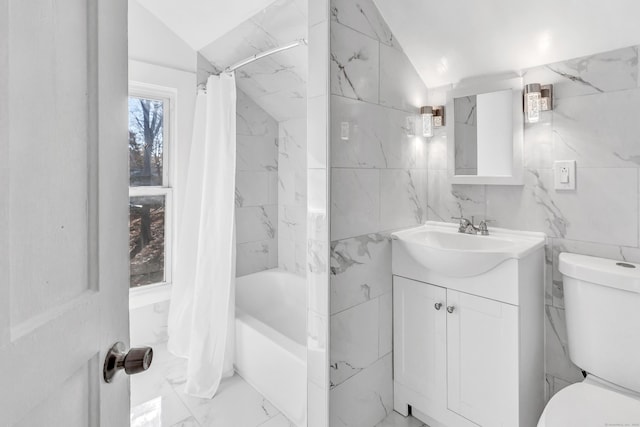 full bathroom featuring shower / bath combination with curtain, vanity, tile walls, toilet, and lofted ceiling