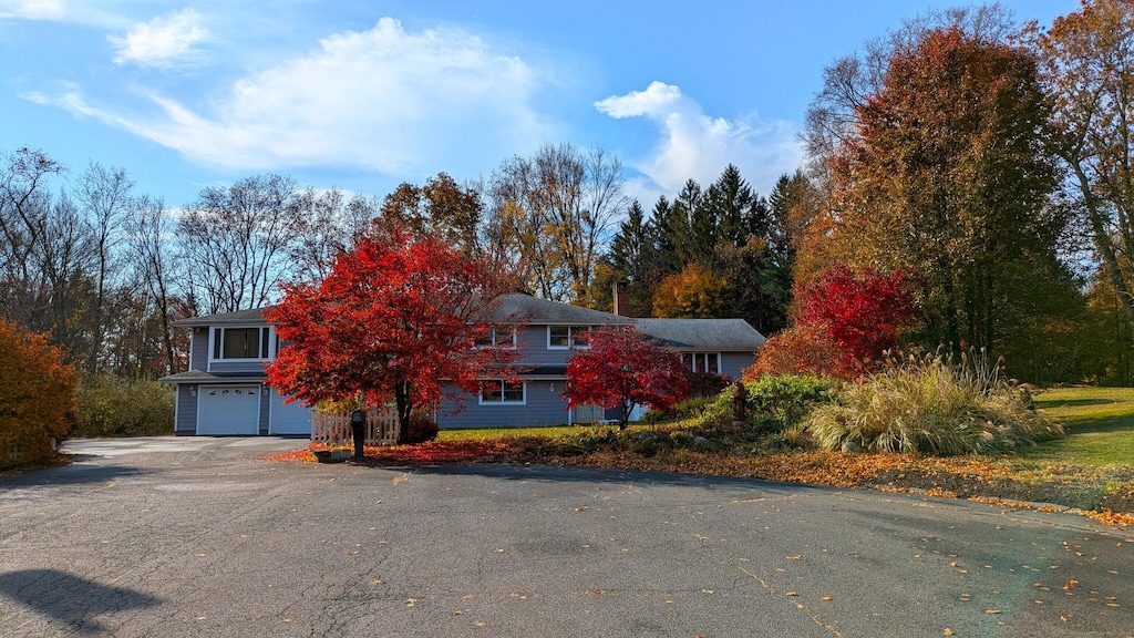 view of front of home with driveway and an attached garage