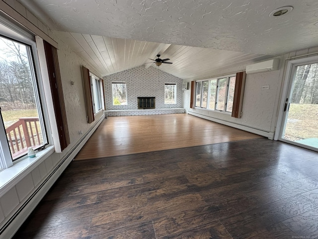 unfurnished living room with vaulted ceiling, a wall mounted air conditioner, a baseboard radiator, and a brick fireplace