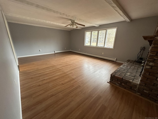 unfurnished living room with baseboards, a ceiling fan, a baseboard radiator, wood finished floors, and beam ceiling