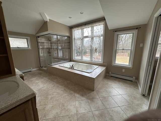 bathroom featuring a baseboard heating unit, a stall shower, a healthy amount of sunlight, and a whirlpool tub