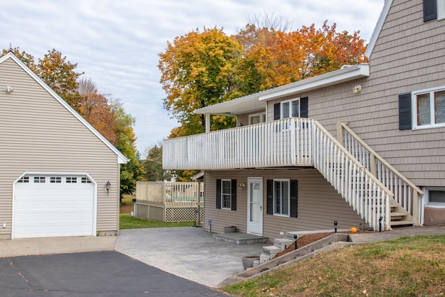 exterior space featuring a deck and a garage