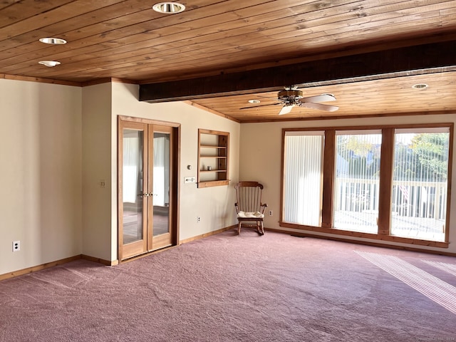 carpeted spare room with wood ceiling, french doors, built in shelves, and ceiling fan