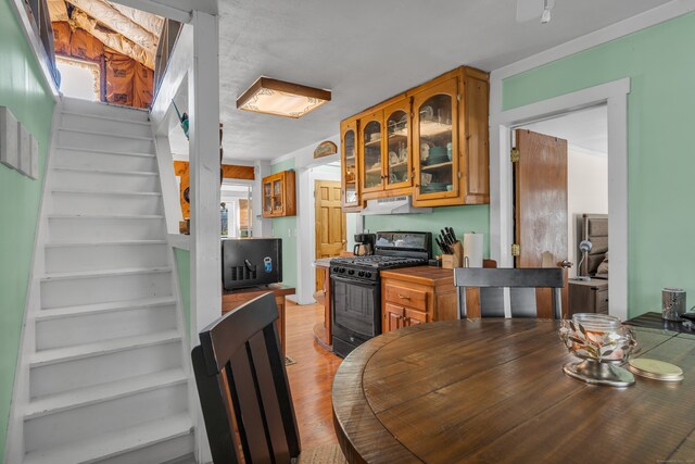 kitchen featuring black gas range oven and light wood-type flooring