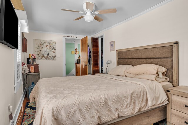 bedroom with crown molding and ceiling fan