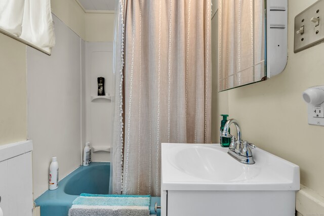 bathroom with vanity and shower / bathtub combination with curtain