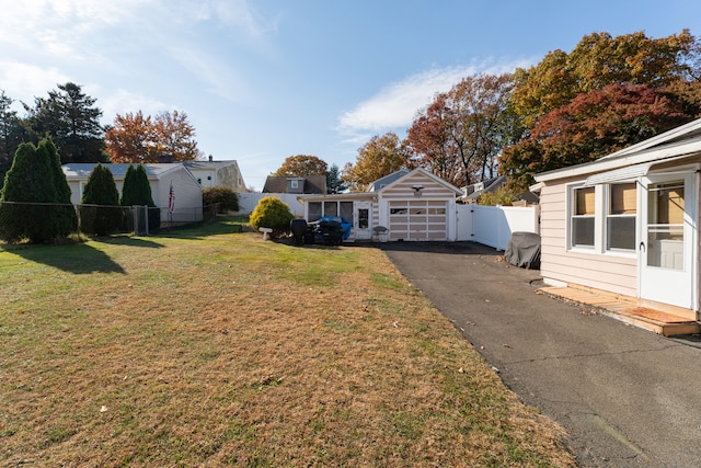 view of yard with a garage