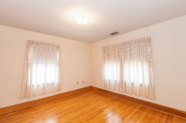 empty room featuring hardwood / wood-style flooring