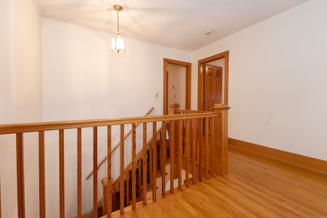 stairs featuring hardwood / wood-style flooring