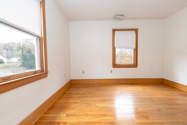 unfurnished room featuring light hardwood / wood-style floors