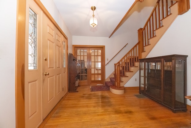 entrance foyer featuring french doors and light wood-type flooring