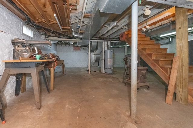 basement featuring water heater and heating unit