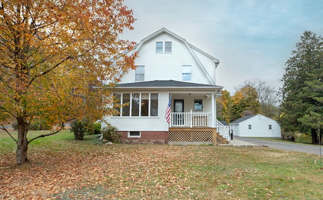 view of front of home featuring a porch and a front yard