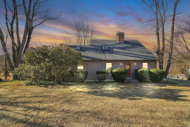 view of front of home with a yard