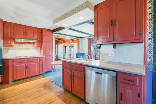 kitchen featuring white gas stovetop, dishwasher, sink, light wood-type flooring, and backsplash