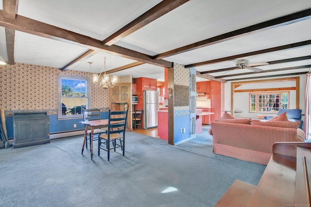 carpeted dining room featuring baseboard heating, ceiling fan with notable chandelier, and beamed ceiling