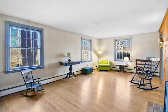 sitting room with light hardwood / wood-style flooring