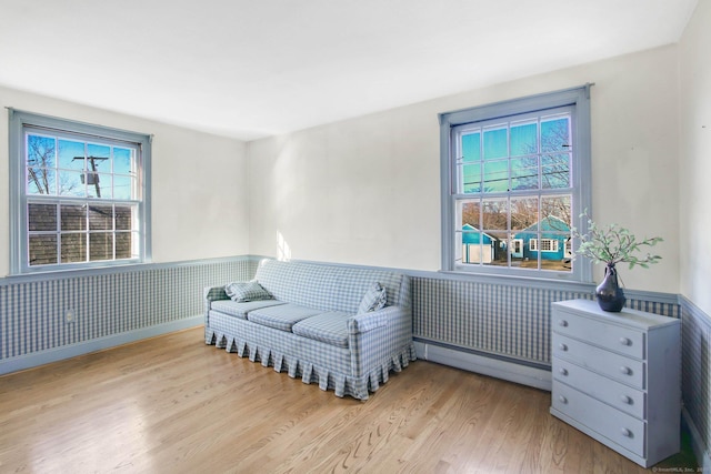 sitting room with light hardwood / wood-style flooring and a baseboard radiator