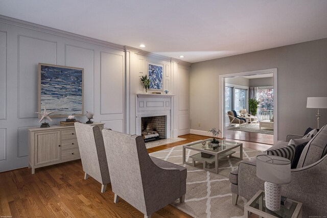 13 Longview Ter Unit 13, Madison, CT 06443 - living room featuring wood finished floors, a fireplace with flush hearth, recessed lighting, baseboards, and a decorative wall