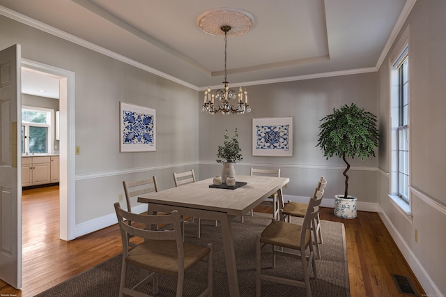 13 Longview Ter Unit 13, Madison, CT 06443 - dining area with wood finished floors, a raised ceiling, a chandelier, and baseboards